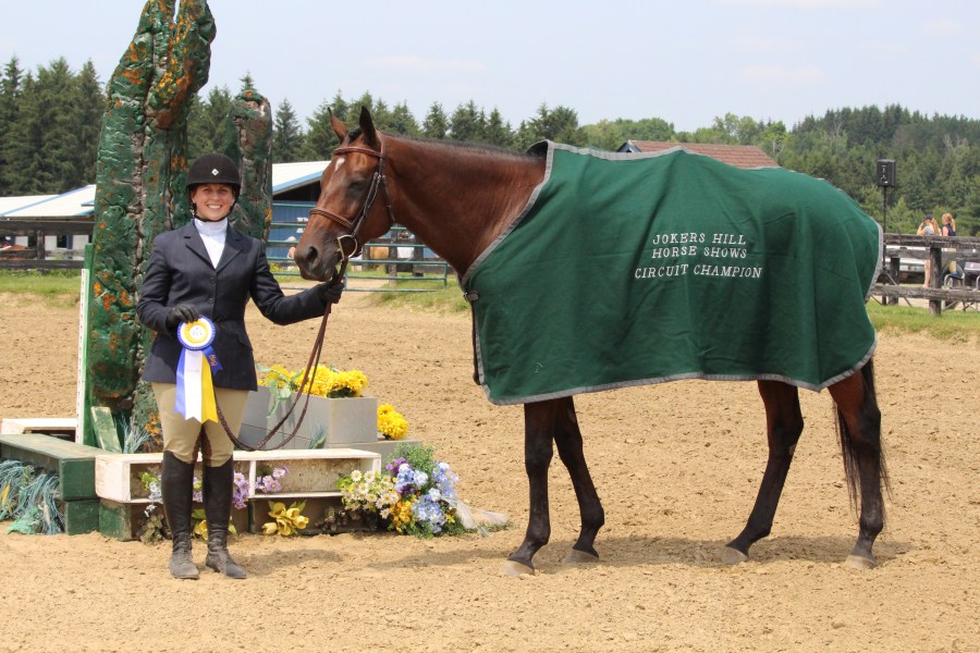 Rossland Stables' riders receiving ribbons