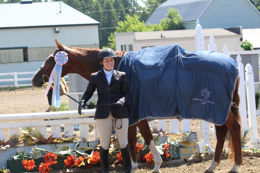 Rossland Stables' riders receiving ribbons