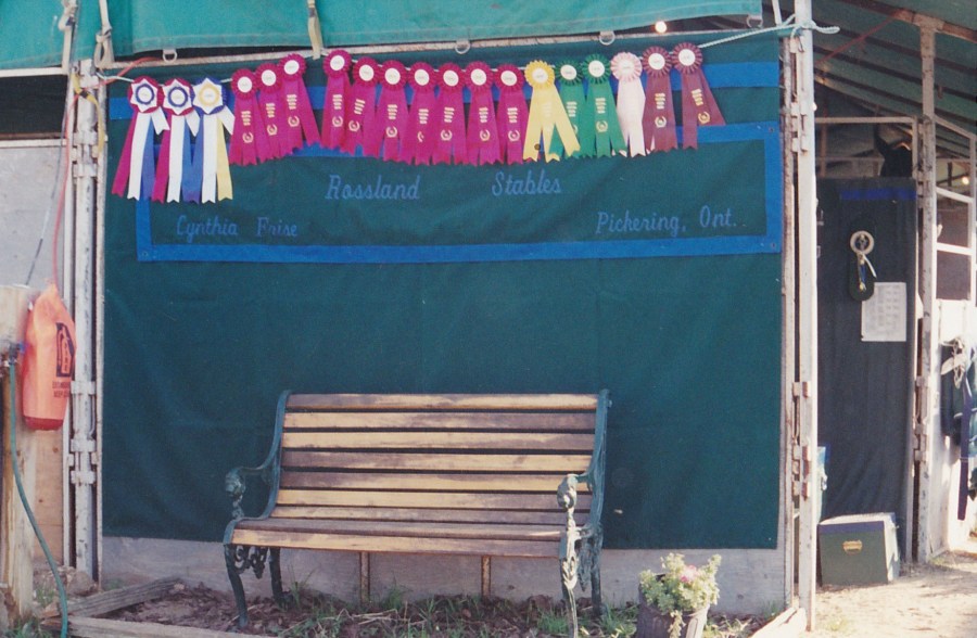 Rossland Stables banner with ribbons