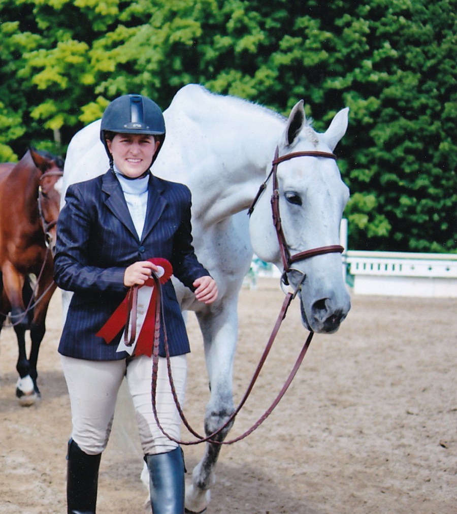 Rossland Stables rider receiving hunter show ribbon