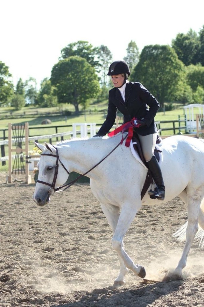 Rossland Stables rider receiving ribbon